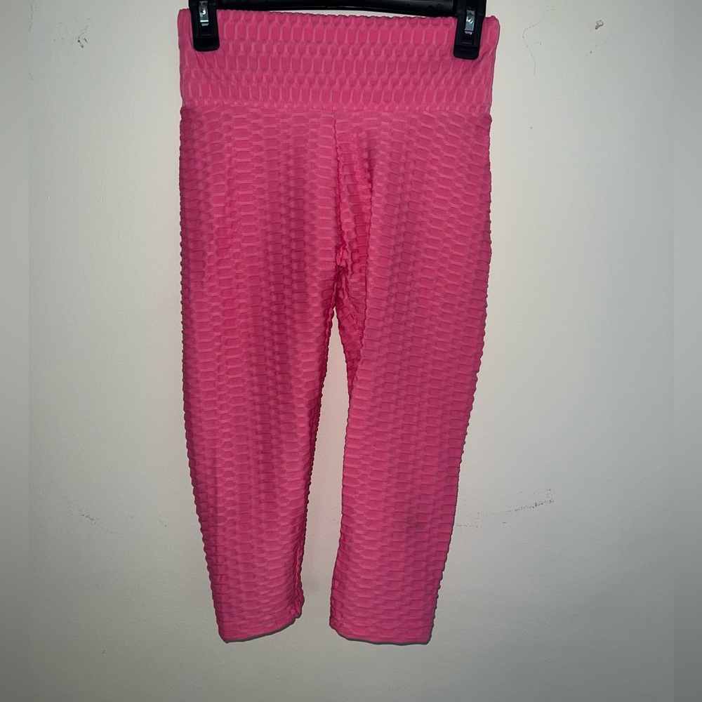 Medium size. Pink pants.